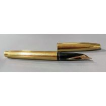 A Sheaffer gold plated fountain pen, the nib stamped SHEAFFER 14K R 585 USA, the cover stamped