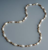 A 9ct gold and pearl necklace and bracelet, set with alternate pearls and gold coloured beads, the
