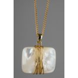 A 9ct yellow gold and mother of pearl pendant, on a 9ct gold chain, total gross weight approx 12.2g