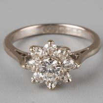 An 18ct white gold and diamond cluster ring, set with a round brilliant-cut diamond approx 0.2ct,
