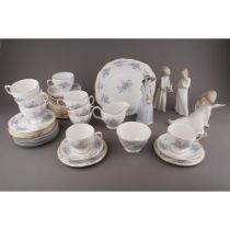 A collection of ceramics to include: Lladro 6487 Girl with shoe boxes; Nao girl with puppy; Lladro