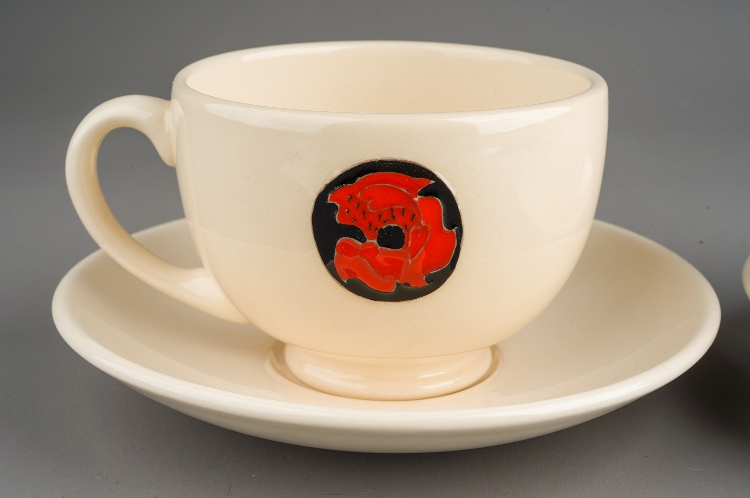 A Moorcroft Flamminium Revival pattern poppy two cups and saucers . Designed by Emma Bossons - Image 3 of 7