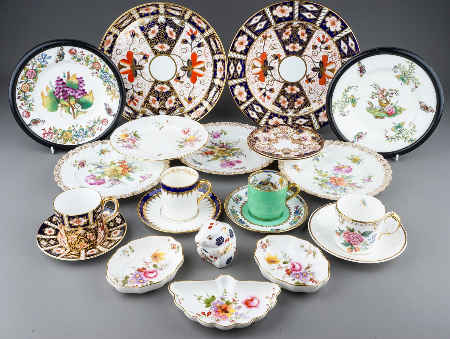 A collection of ceramics to include Dresden porcelain plates, Royal Crown Derby plates, cups,