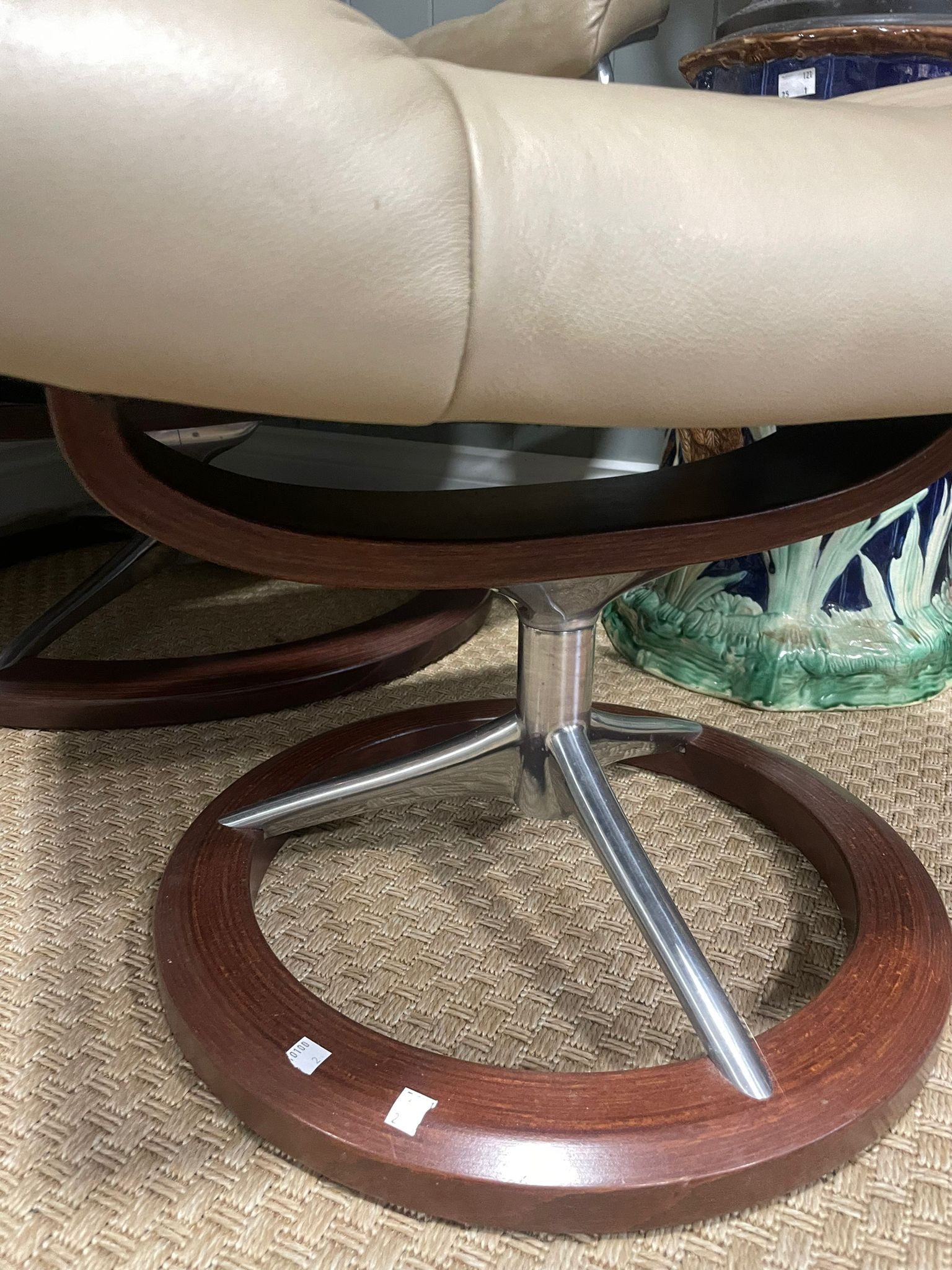 A retro mid 20th century stressless reclining swivel armchair and foot stool. Having a rectangular - Image 2 of 5