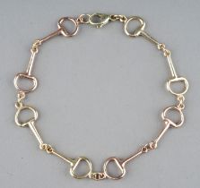 A 9ct yellow and rose gold snaffle bit bracelet, approx 20cm long, gross weight approx 6.2g