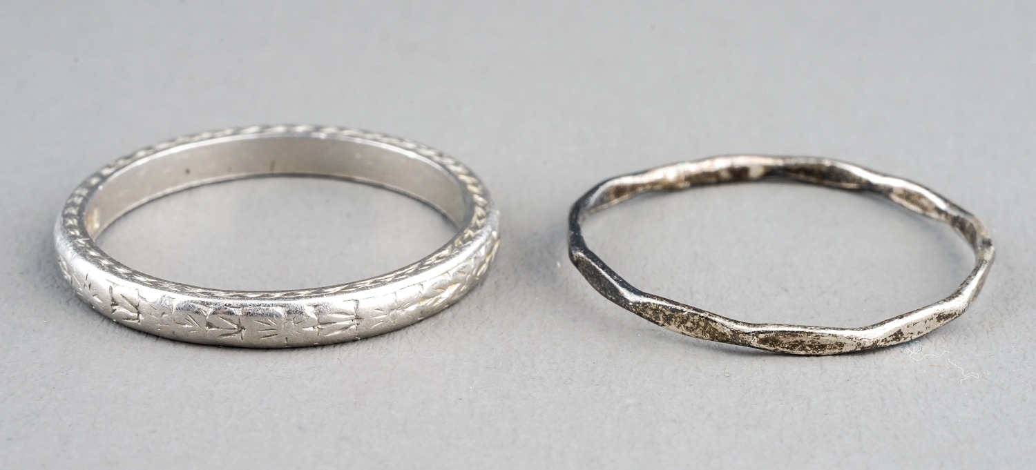 A platinum band, engraved detail, size M, gross weight approx 3.6g; together with a white metal ring - Image 2 of 6
