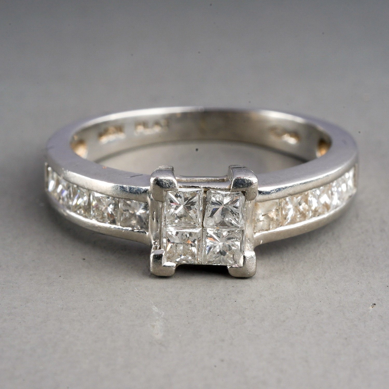A platinum and diamond ring, set with four princess-cut diamonds in a square settings, set with - Image 2 of 5