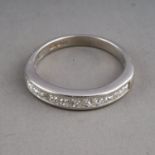 A platinum and diamond half eternity ring, set with eleven princess-cut diamonds, size I1/2, gross