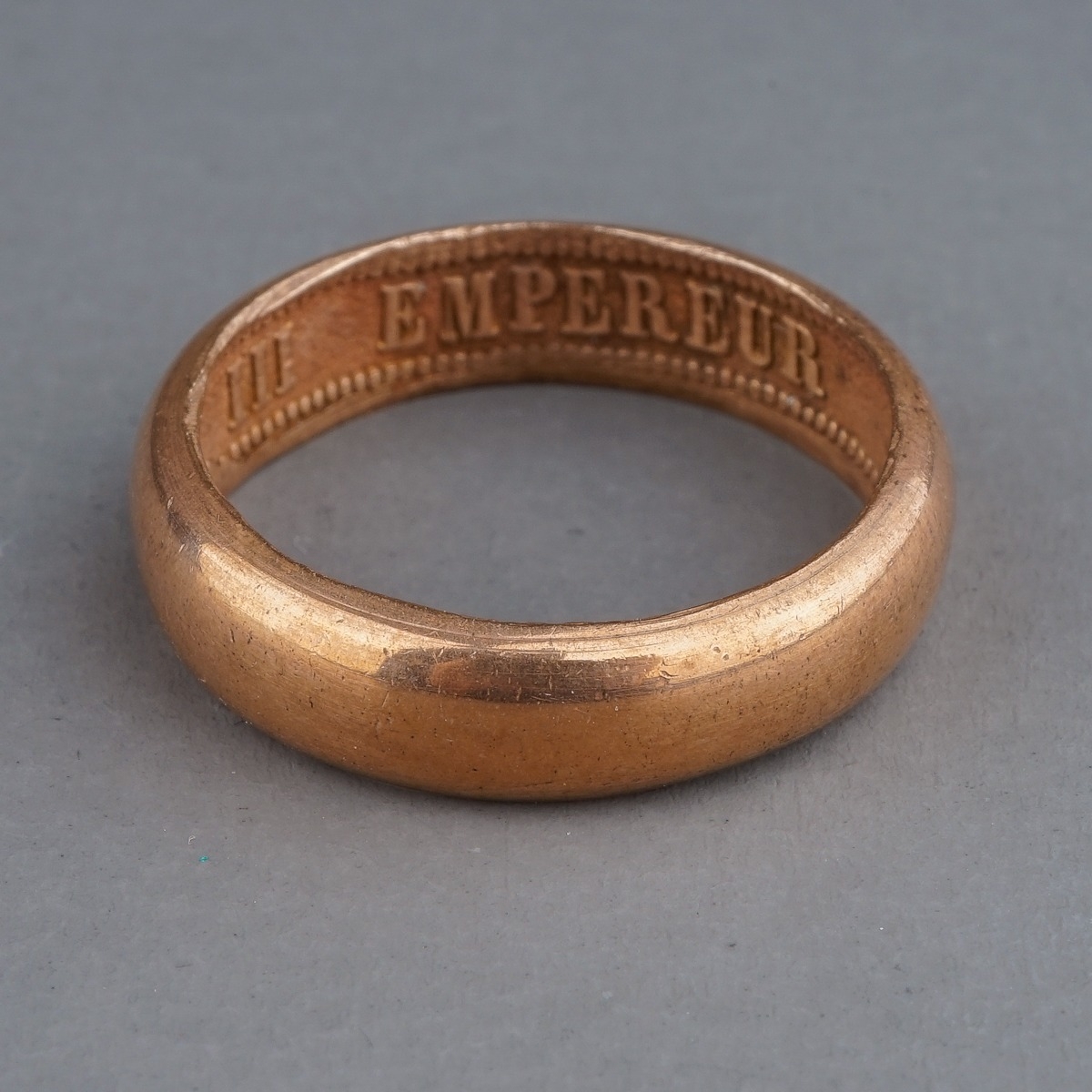 A rose gold ring, of plain design, the inner shank inscribed 'NAPOLEON EMPEREUR III 1861', size R,