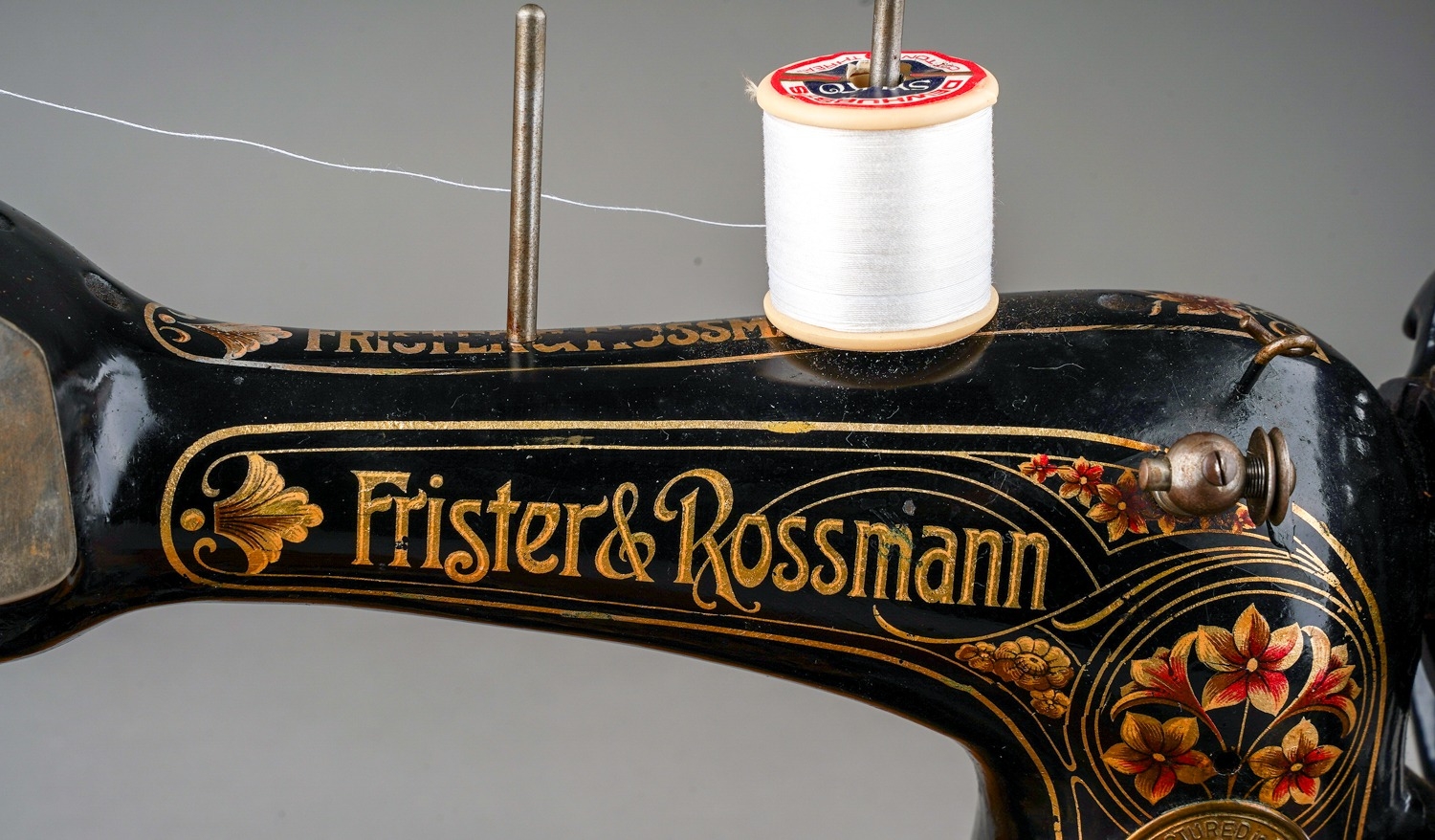An early 20th Century cased Frister & Rossman black and gilt cranked sewing machine, the stand - Image 2 of 7