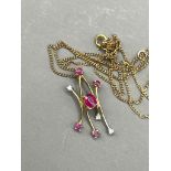 A 9k yellow gold ruby and diamond pendant necklace, gross weight approx 1.4g
