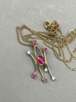 A 9k yellow gold ruby and diamond pendant necklace, gross weight approx 1.4g