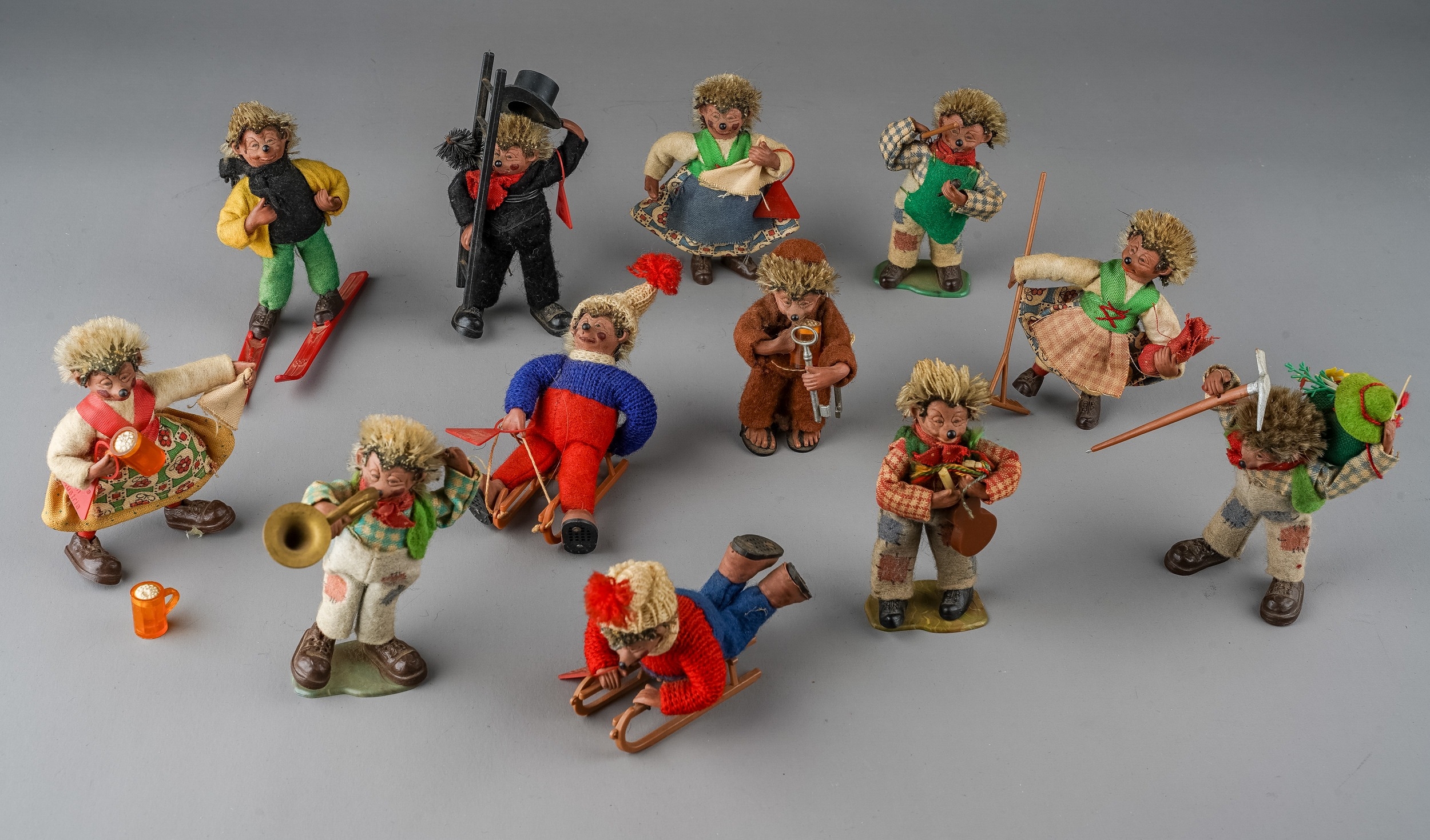 Steiff: a collection of twelve Peter Figuren Mecki hedgehogs to include: monk, chimney sweep, skier,