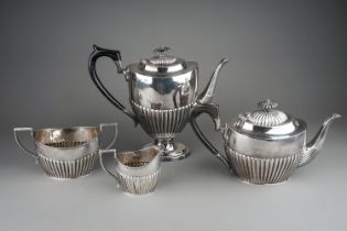 A matched Georgian style silver four piece tea and coffee service comprising teapot, coffee pot,