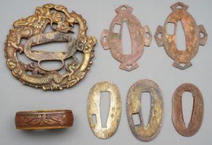 Seven brass pieces which look to have belonged to a Japanese Sword.