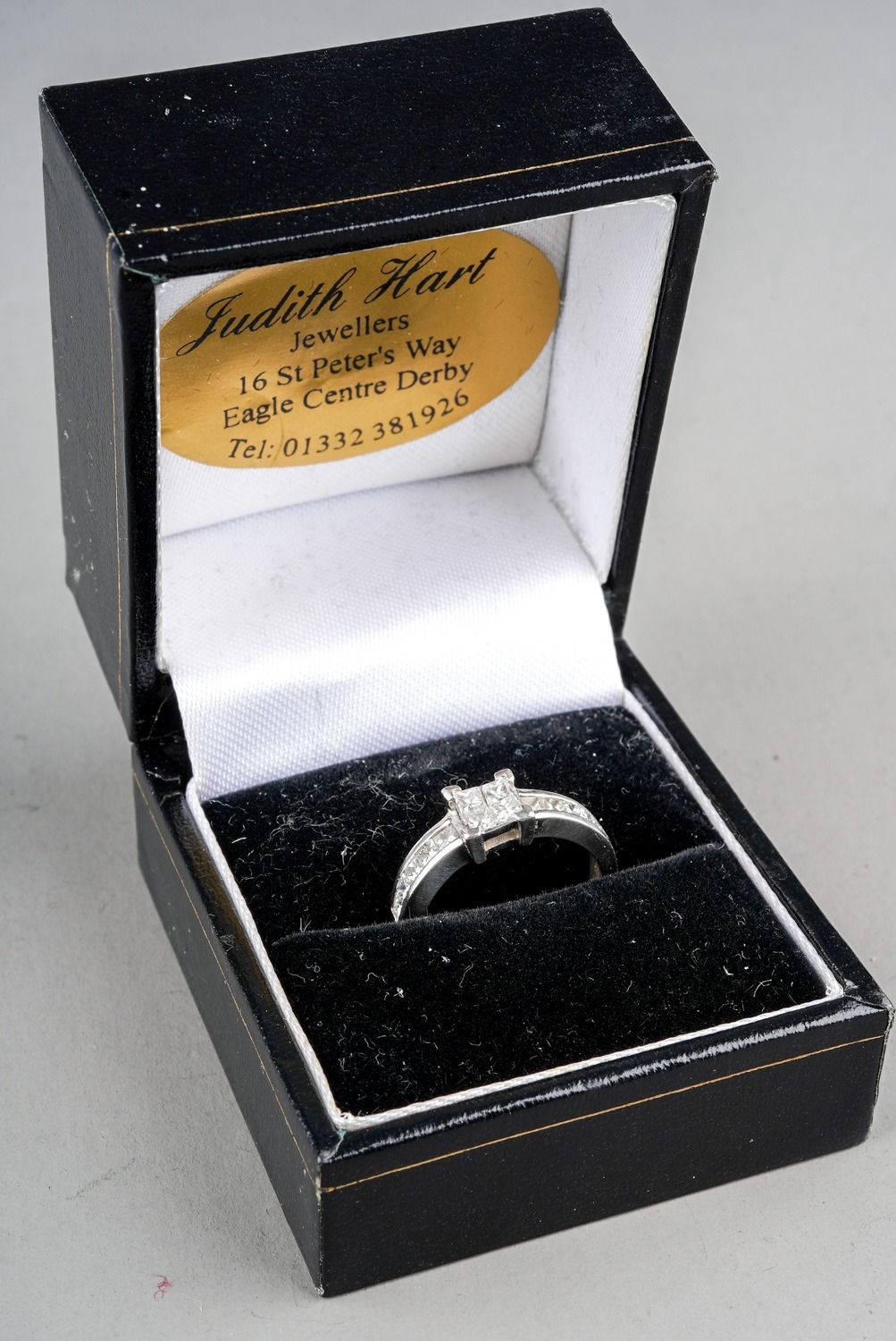 A platinum and diamond ring, set with four princess-cut diamonds in a square settings, set with - Image 5 of 5