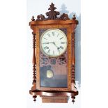 A late 19th Century American style inlaid mahogany cased wall clock, cream dial with Roman Numerals,