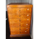 A fine 6 draw oak specimen cabinet with contents of fossils and mineral exaples