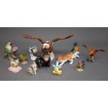 A large Beswick 1018 Bald Eagle, a group of small Beswick finches and an Eagle together with