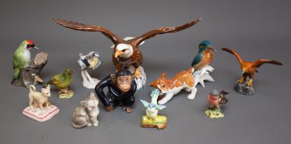 A large Beswick 1018 Bald Eagle, a group of small Beswick finches and an Eagle together with