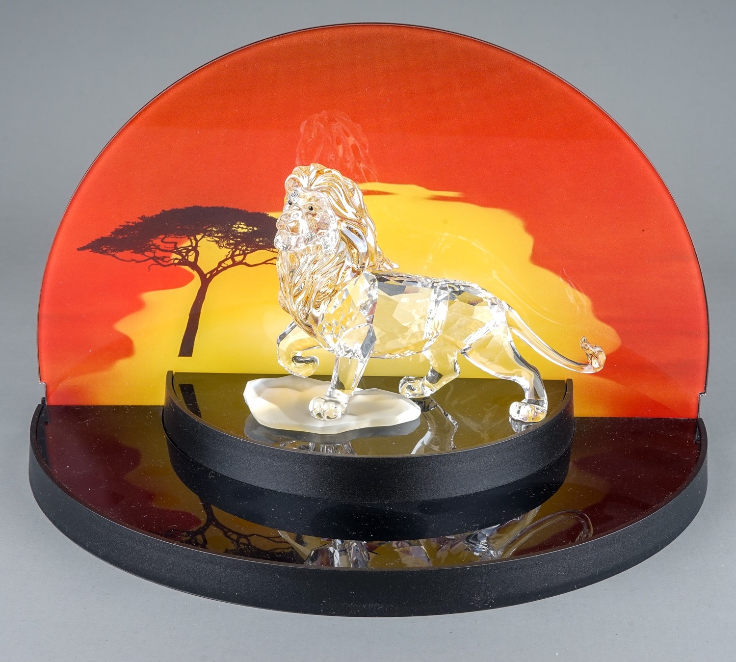 A Swarovski Disney Lion King tinted crystal figure of Mufasa, boxed with outer sleeve together