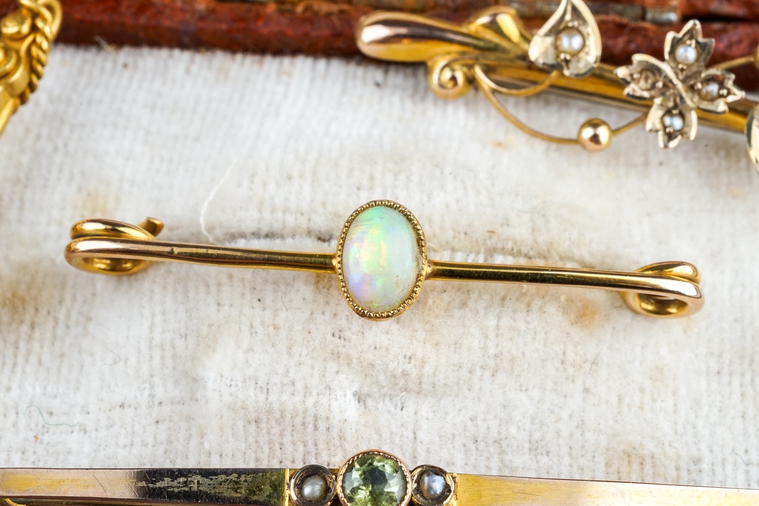 A collection of four Edwardian 9ct yellow gold bar brooches, including seed pearl, opal, peridot, - Image 9 of 12