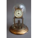 An early 20th Century brass 400 day Anniversary clock, Arabic dial, the movement stamped 77525, with