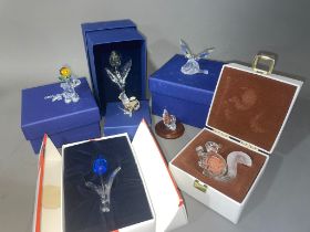 A collection of small Swarovski Crystal Club boxed models to include: 10th Anniversary Edition - The