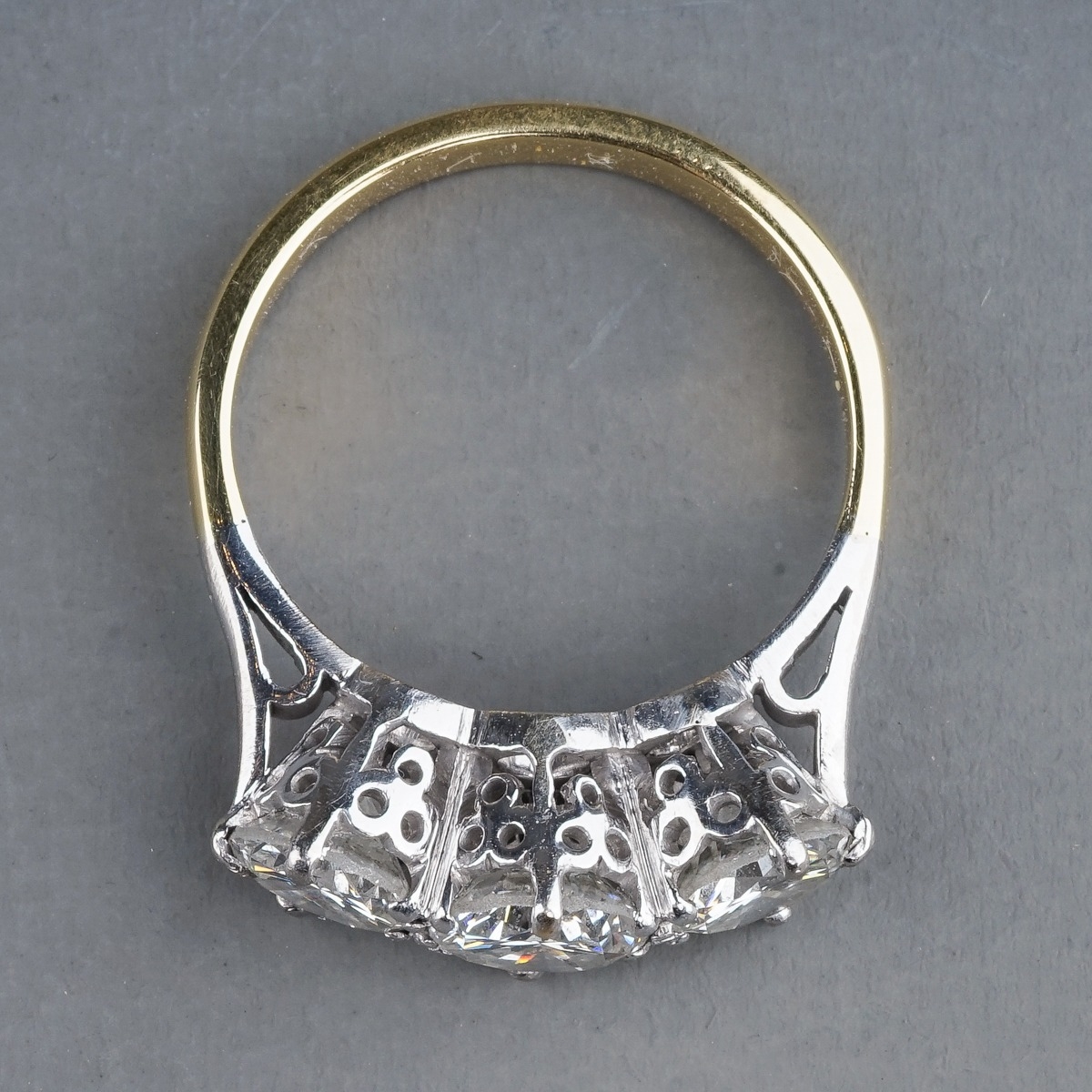 A yellow gold and diamond three-stone ring, set with round brilliant-cut diamonds, centre stone - Image 3 of 6