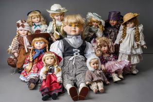A collection Modern decorative dolls and associated furniture