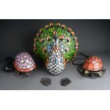 Three novelty Modern stained glass and metal mounted table lamps including one large peacock and two