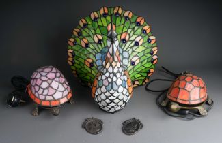 Three novelty Modern stained glass and metal mounted table lamps including one large peacock and two