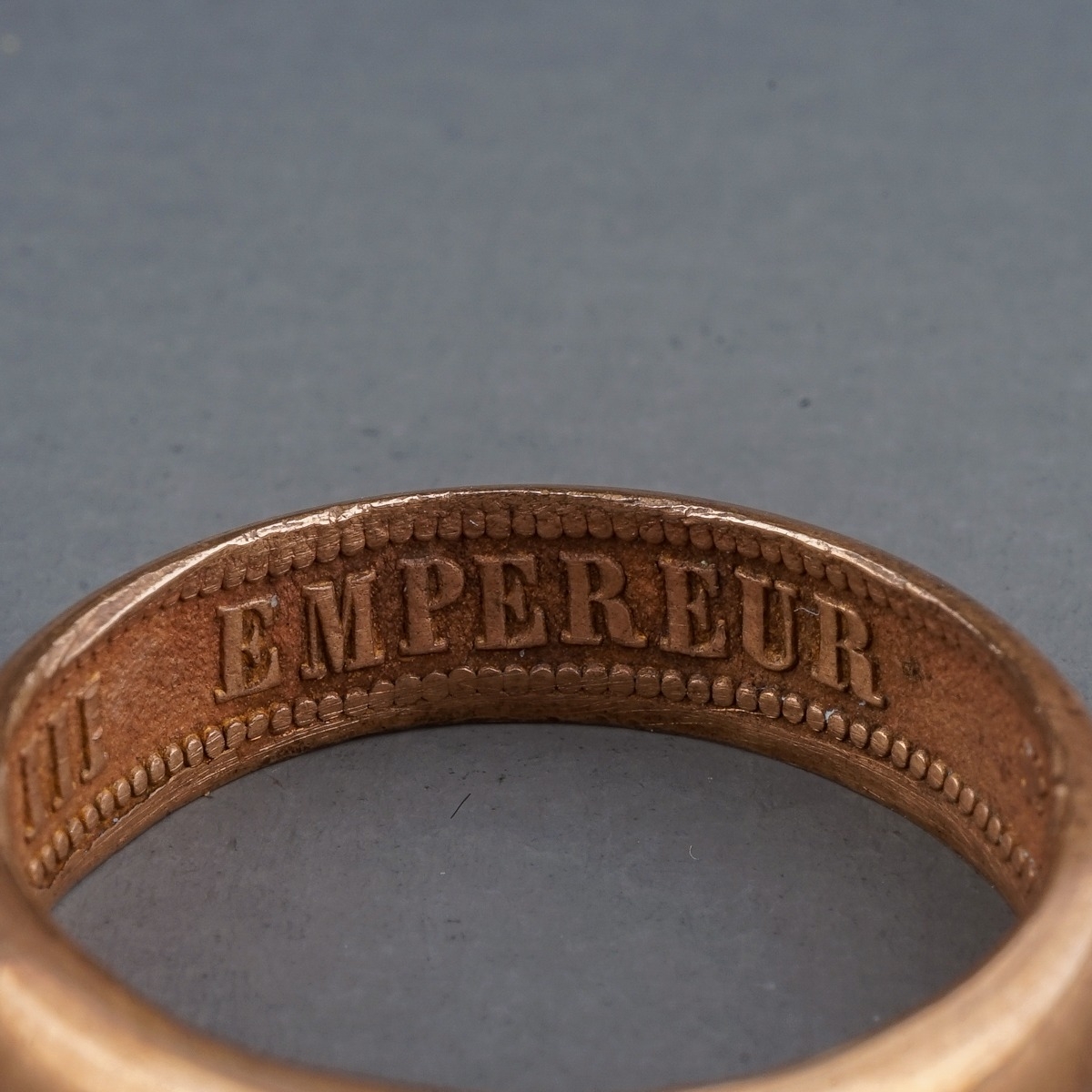 A rose gold ring, of plain design, the inner shank inscribed 'NAPOLEON EMPEREUR III 1861', size R, - Image 3 of 4