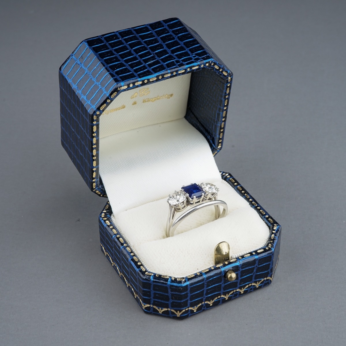 An early 20th century platinum diamond and sapphire three-stone ring, the rectangular-cut sapphire - Image 6 of 6