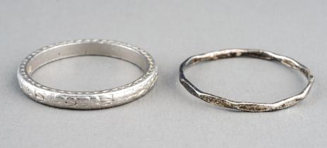 A platinum band, engraved detail, size M, gross weight approx 3.6g; together with a white metal ring