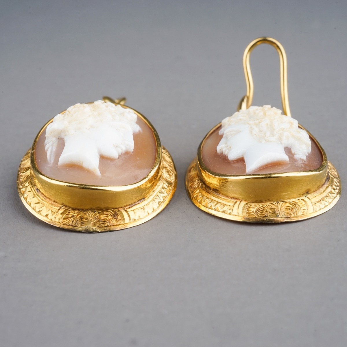 A pair of 19th century yellow gold and cameo earrings, set with shell cameos carved depicting - Image 2 of 3