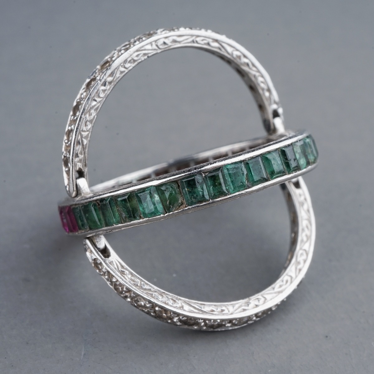 An Art Deco platinum diamond ruby and emerald swivel or flip ring, set with calibre cut rubies and - Image 6 of 6