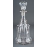 An Art Nouveau style glass decanter, the side applied with eight high relief straps, with matching