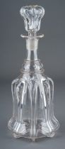 An Art Nouveau style glass decanter, the side applied with eight high relief straps, with matching