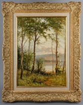 Ernest Parton ROI (American 1845-1933) Woodland with lake beyond oil on board, 34 x 24cm signed