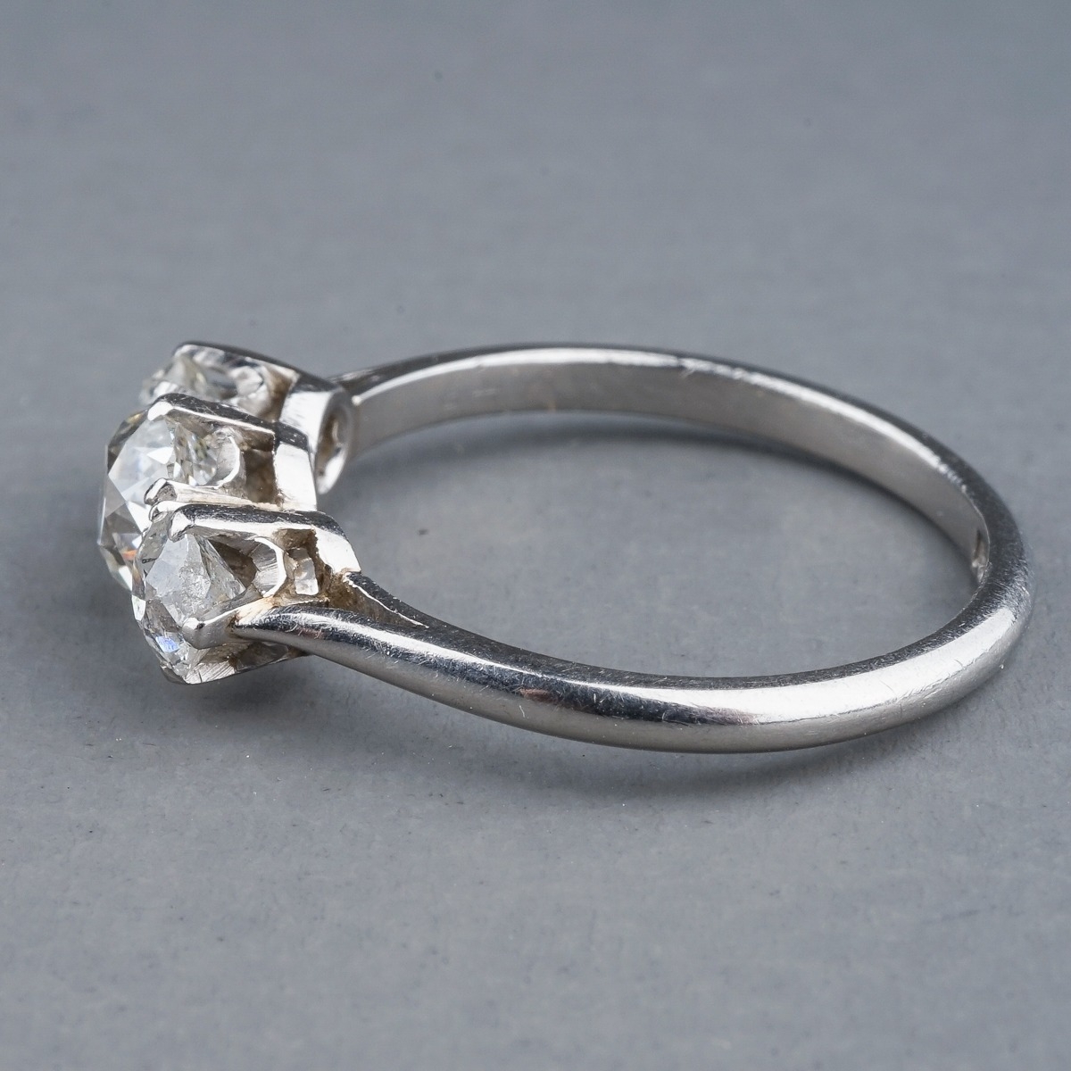 A platinum and diamond three stone ring, set with old-cut diamonds, estimated total diamond weight - Image 5 of 6