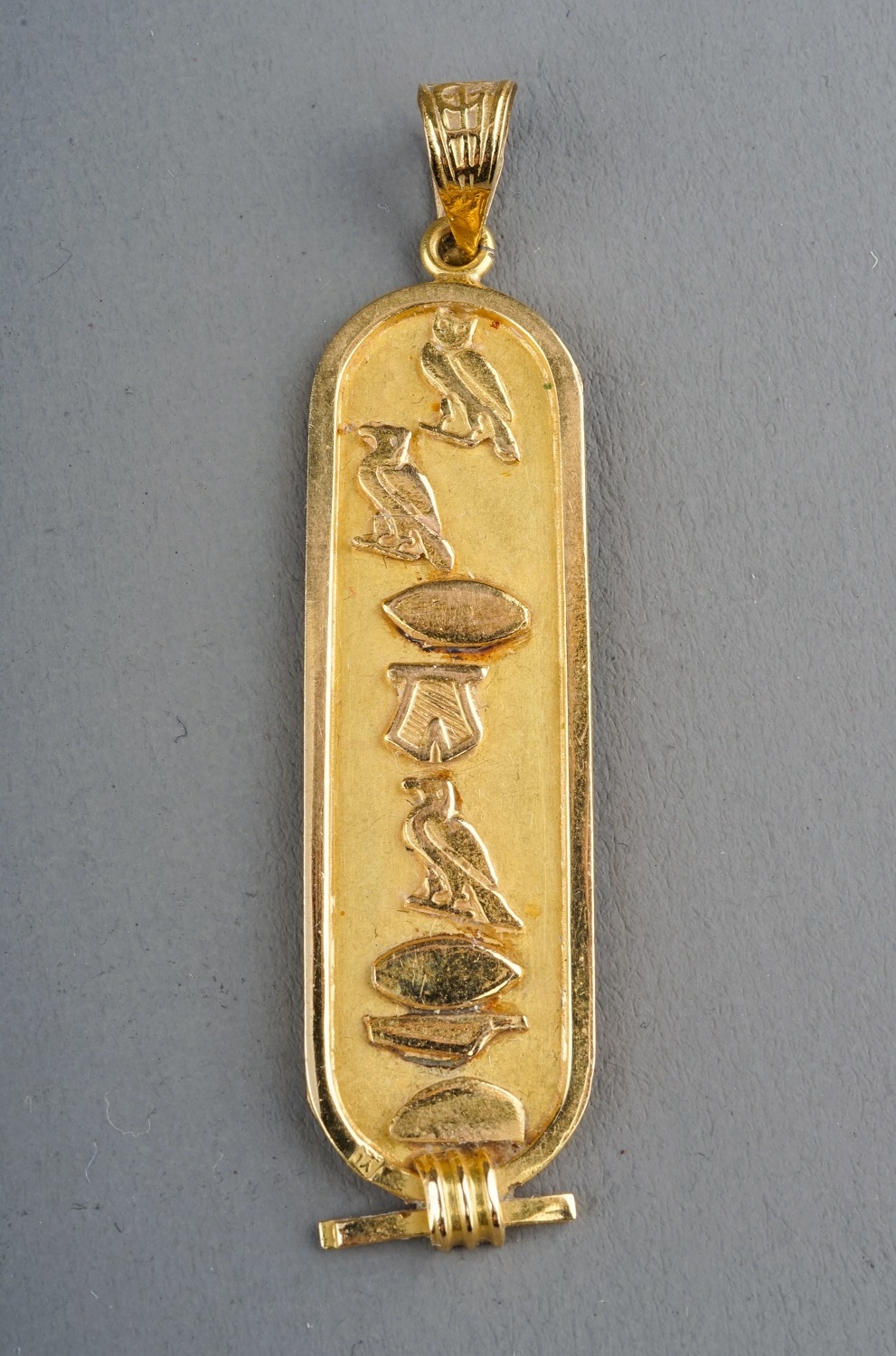 An Egyptian yellow gold pendant, cast with hieroglyphics, control mark to back, approx 5.2cm long, - Image 2 of 6