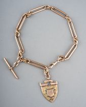 A Victorian 9ct yellow gold trombone link watch chain, with shield fob and t-bar, chain approx 37.