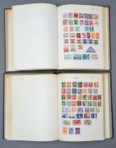 A pair of Tower loose leaf stamp albums with World collection, a few early examples included