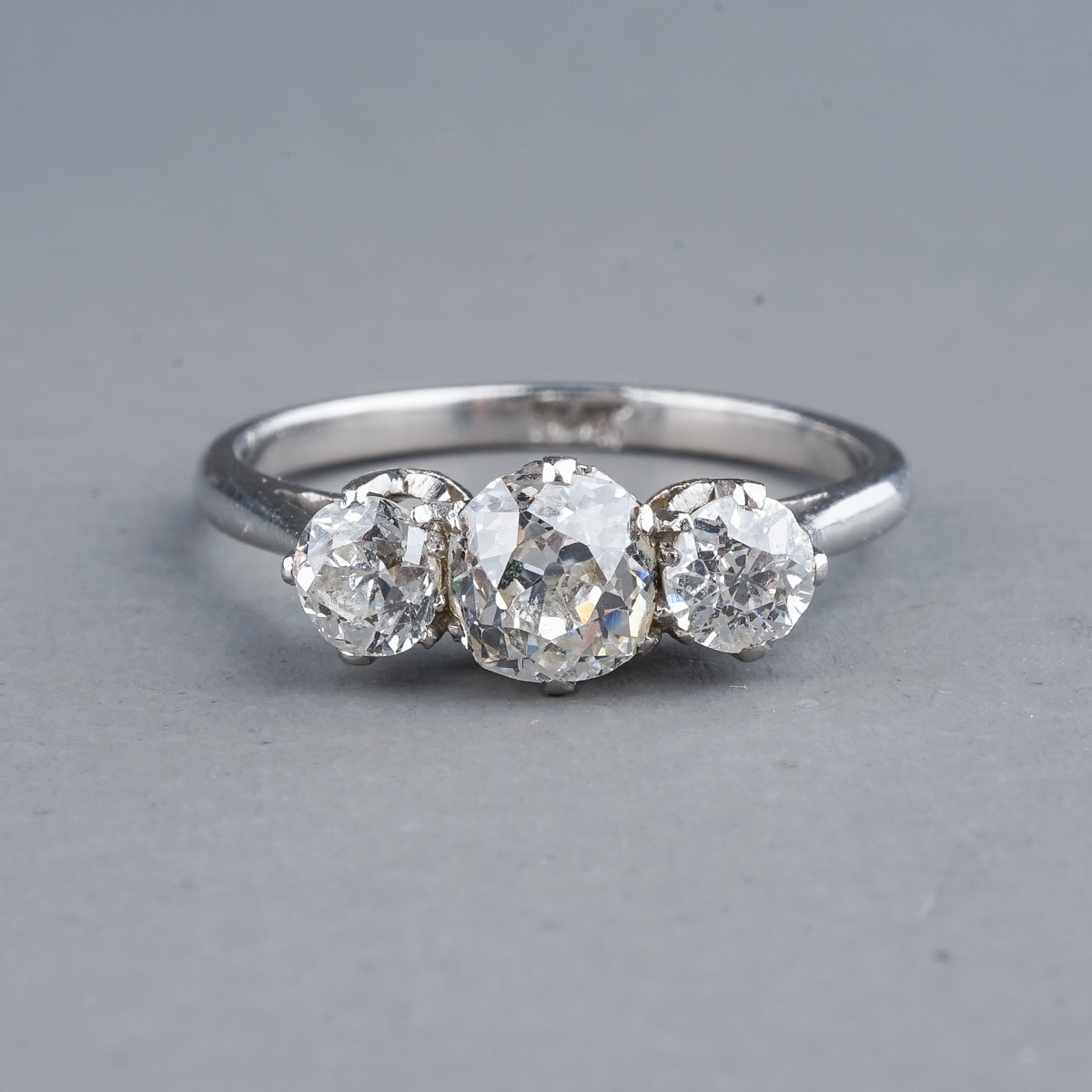 A platinum and diamond three stone ring, set with old-cut diamonds, estimated total diamond weight - Image 2 of 6