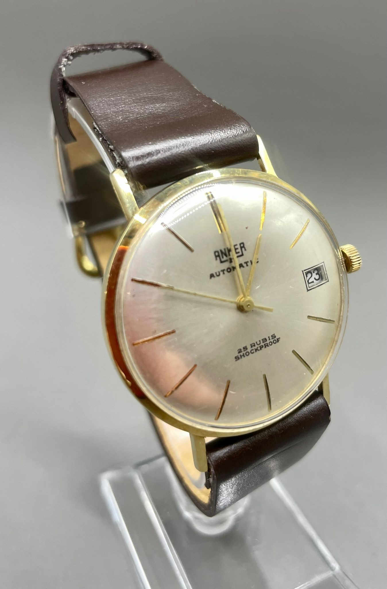 A gentleman's 14k yellow gold Anker 21 Automatic wristwatch, 32mm silvered dial with baton
