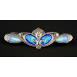 An Art Nouveau silver and enamel bar brooch, four oval blue and green panels in sinuous lines,