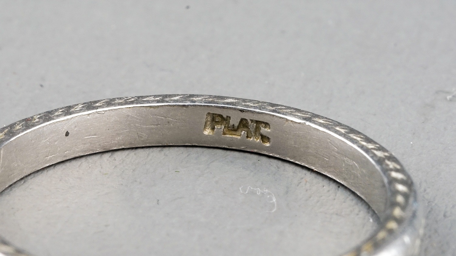 A platinum band, engraved detail, size M, gross weight approx 3.6g; together with a white metal ring - Image 6 of 6