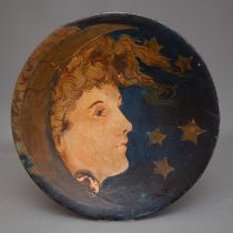 An early 20th Century Continental painted earthenware charger painted with a Lady wearing crescent