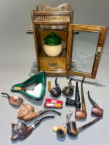 A collection of pipes to include Meerschaum - one cased Gentleman wearing a turban; another of a man